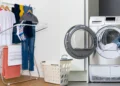 Heated clothes airer beside a tumble dryer comparing UK laundry drying costs