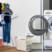 Heated clothes airer beside a tumble dryer comparing UK laundry drying costs